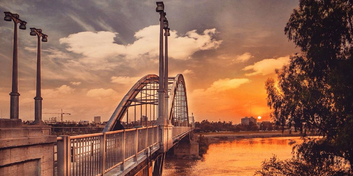 تصویری از غروب آفتاب و کارون و پل های اهواز